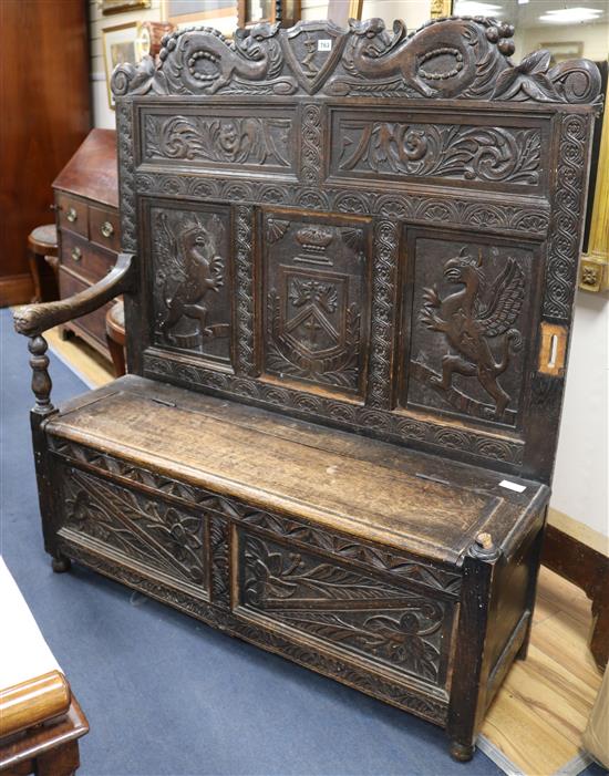 A 17th century style monks bench, W.120cm